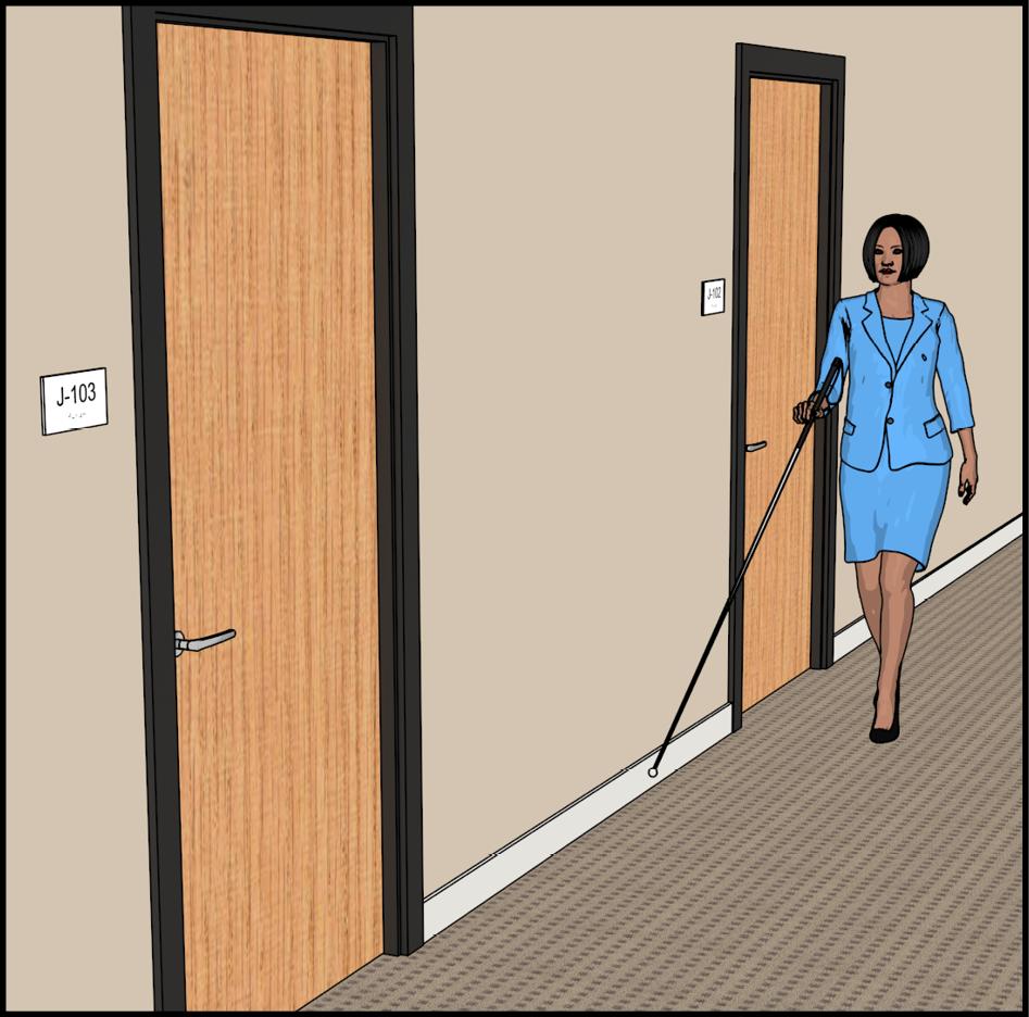 Woman with long white cane walking along hallway with doors. Each door is labeled with an adjacent sign.